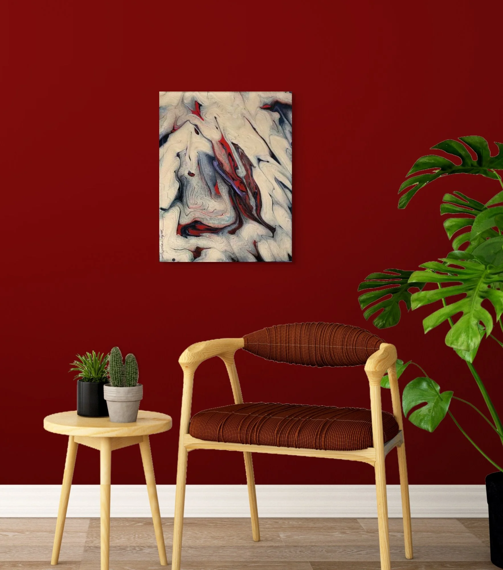 Interior room with red wall, modern abstract painting, wooden chair with brown cushion, round side table with three potted plants, and large green monstera plant.