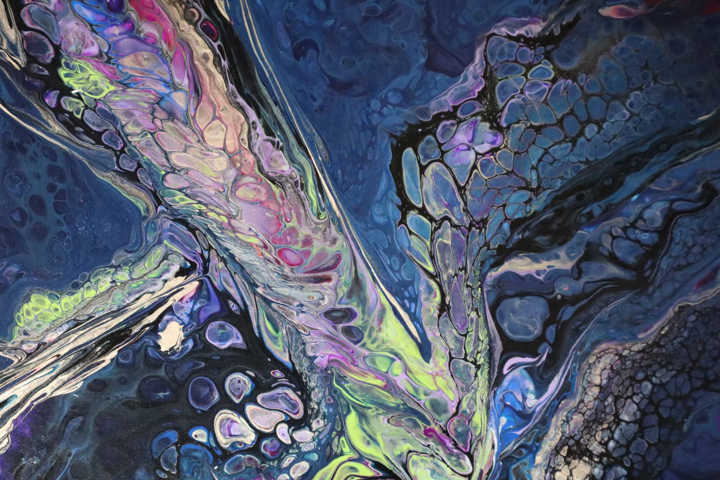 Abstract fluid art painting with swirling patterns and vibrant colors including blue, purple, pink, yellow, and black.