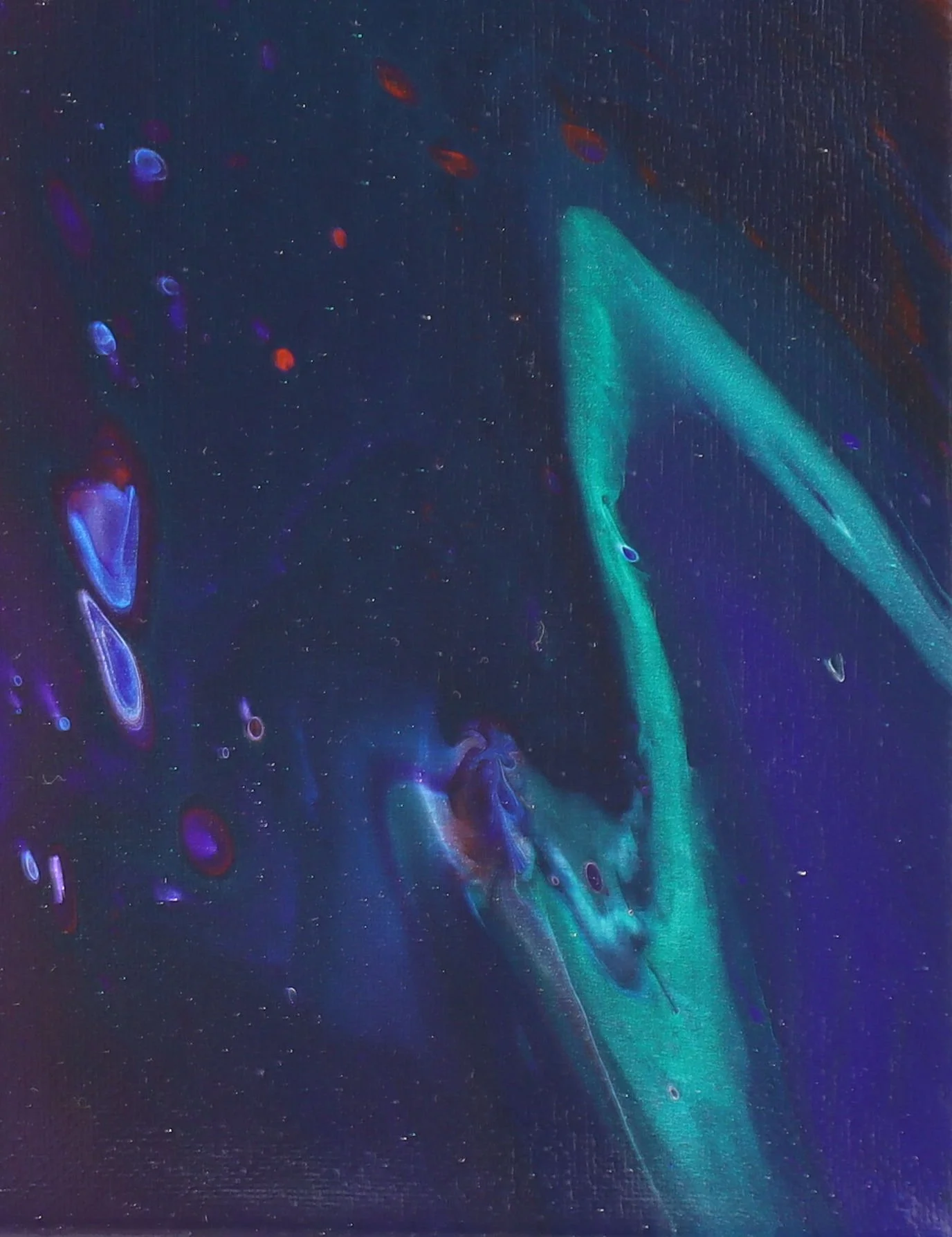 Abstract image with dark background and fluid-like swirls in shades of blue, green, and purple, with scattered small oval and circular shapes.