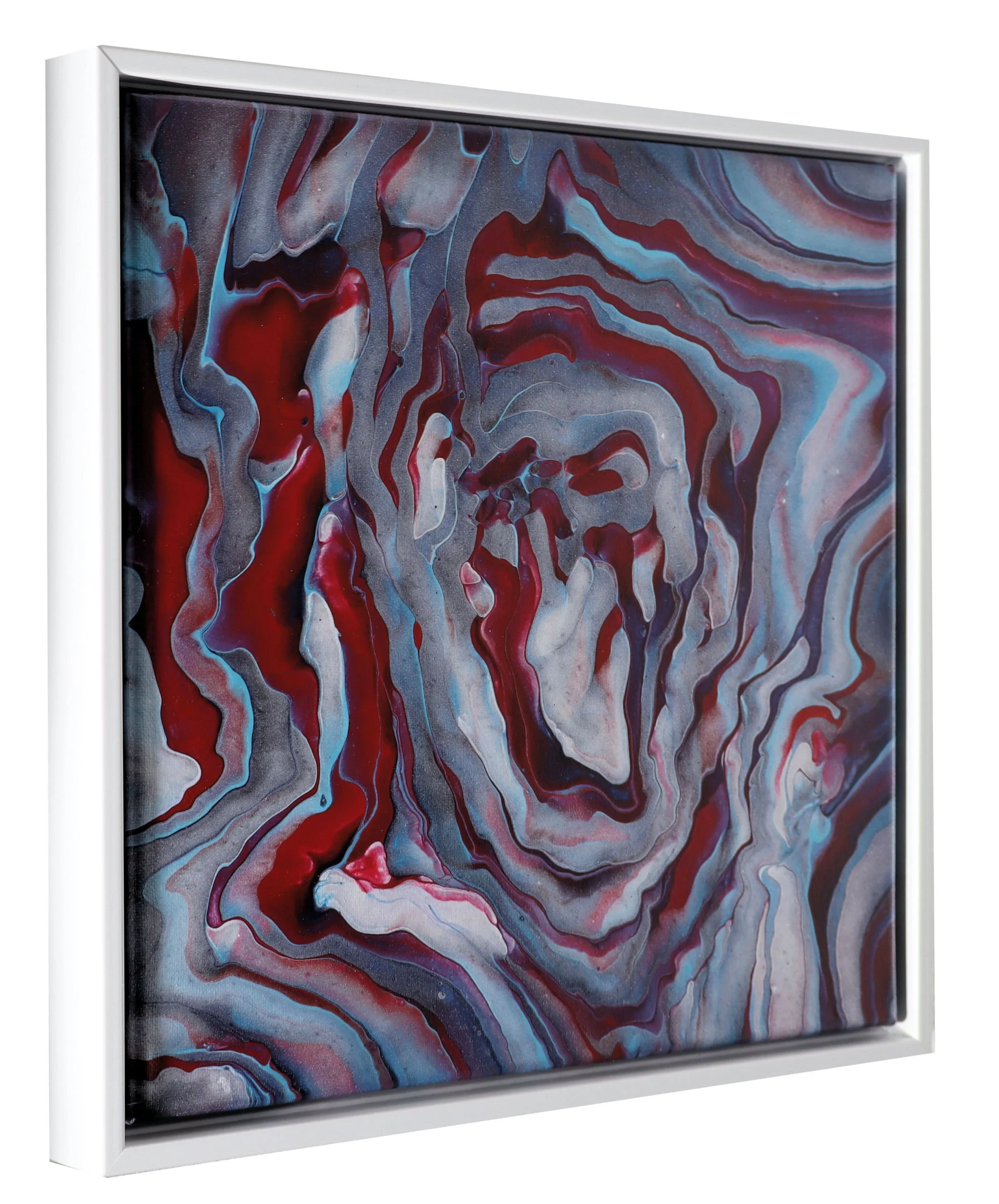 Close-up of a framed abstract painting with swirling patterns of red, blue, black, and white colors.