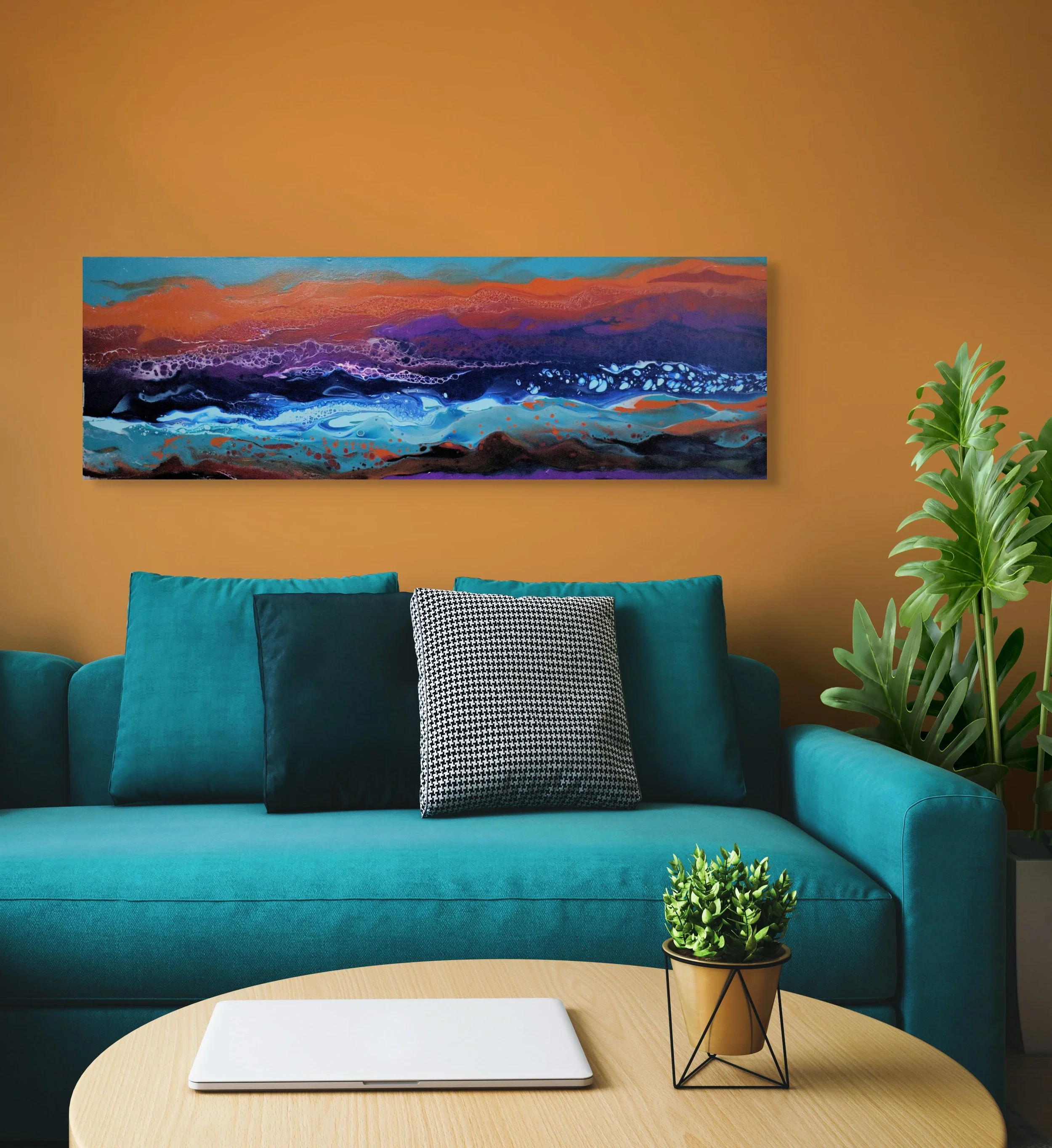 A modern living room with a teal sofa, black and white patterned throw pillow, abstract landscape painting on the brown wall, green houseplant on a side table, and a beige wooden coffee table with a closed silver laptop and a potted succulent plant.