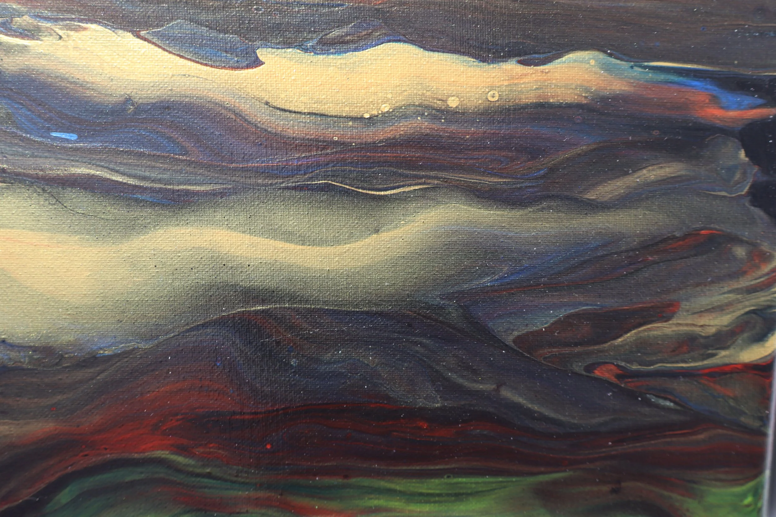 Close-up view of an abstract painting with swirling patterns of yellow, blue, red, and black on canvas.