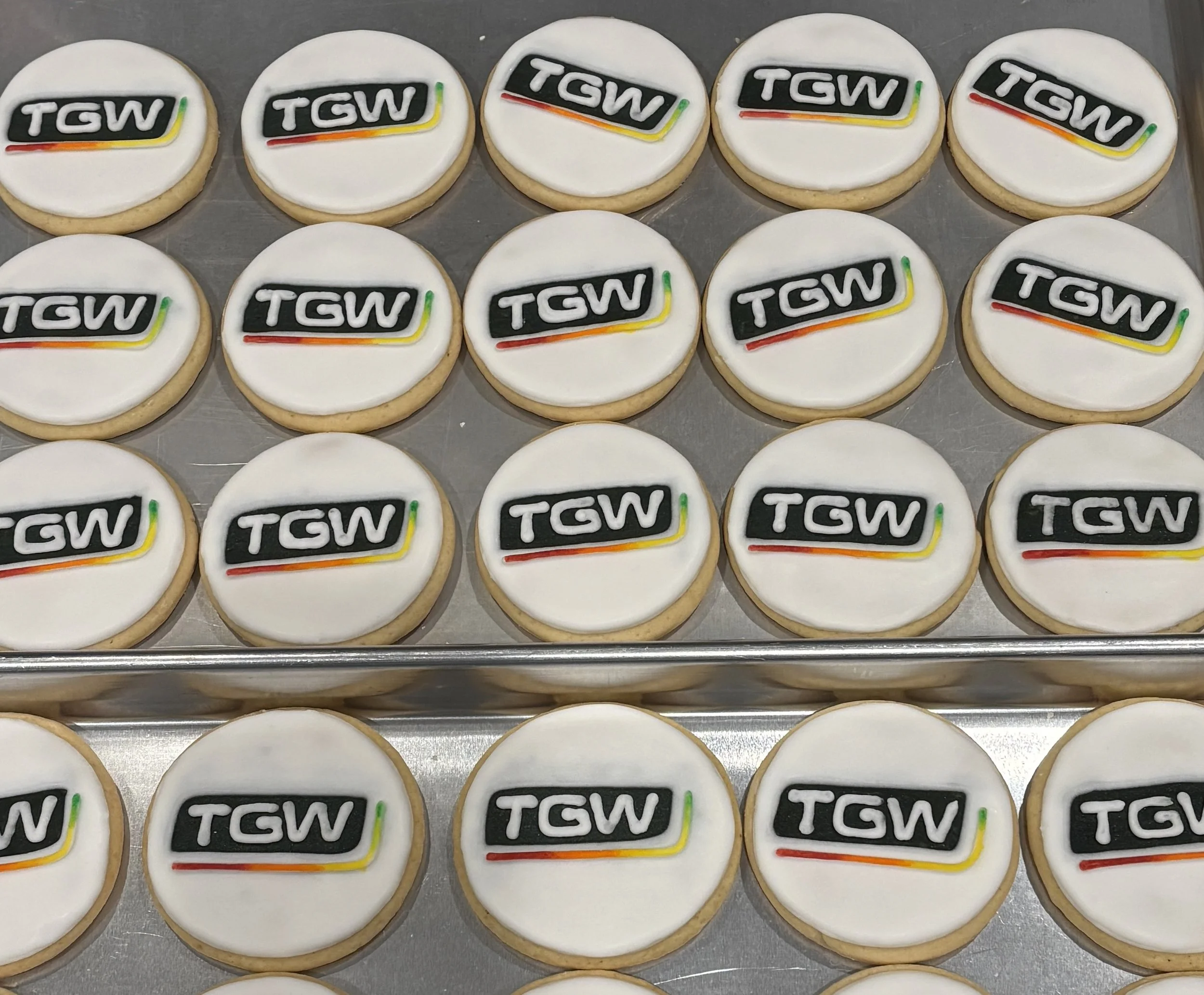 Custom TGW logo cookies for a corporate order from Mary's Bakehouse