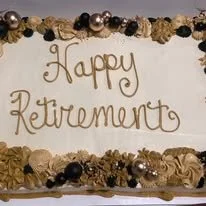 blakc and gold retirement cake.jpg