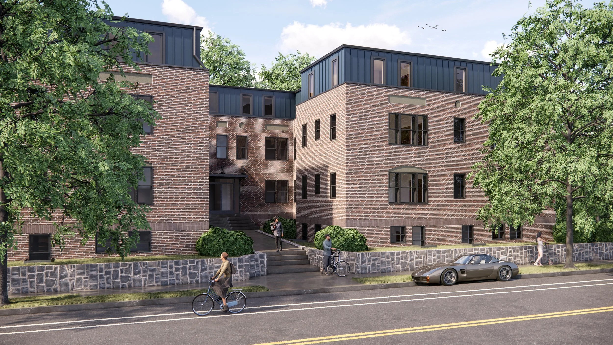 A modern multi-story brick apartment building with large windows, surrounded by trees, with people walking and biking on the sidewalk and a parked car in front.