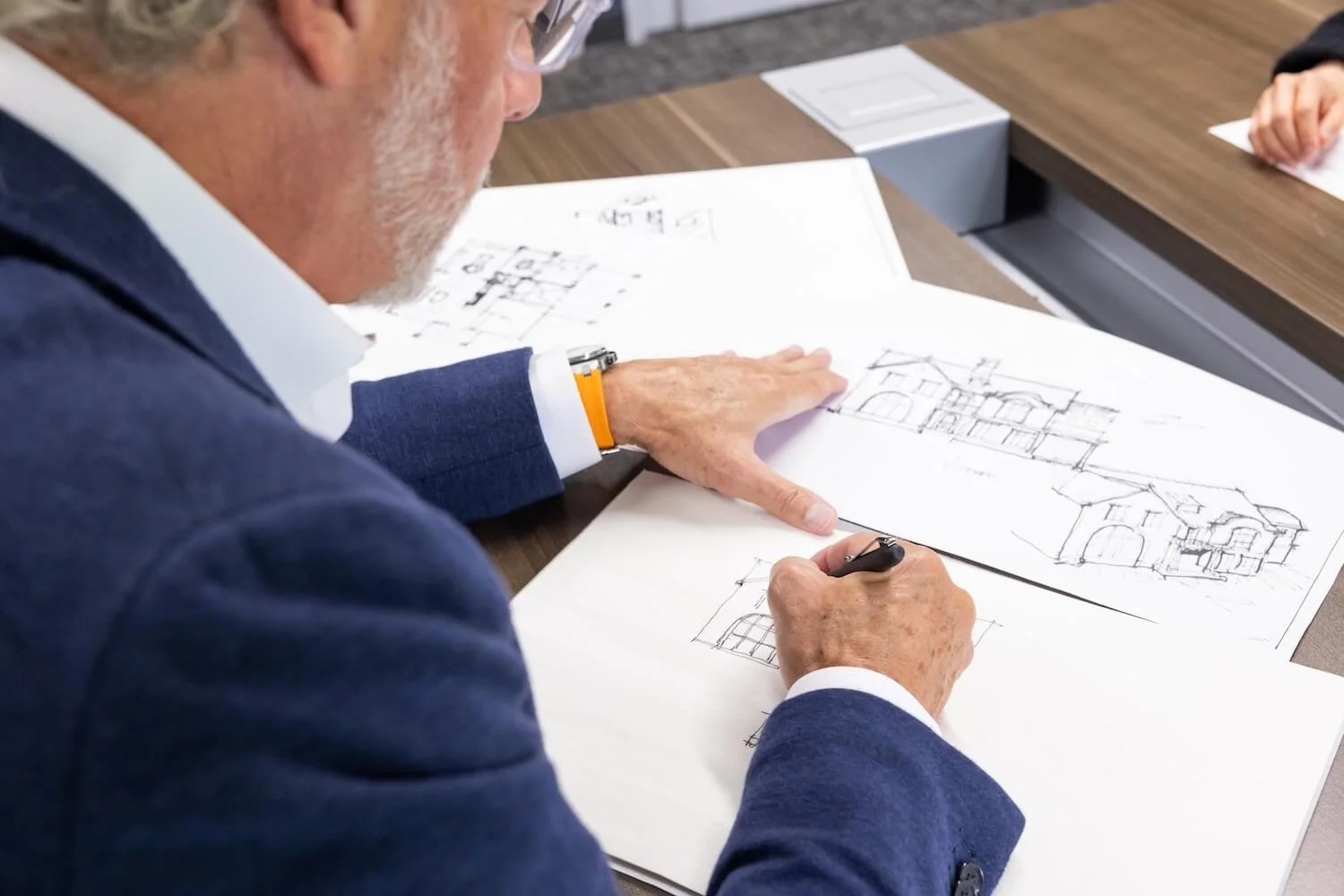 Wayne Visbeen sketches architectural drawings in a live design session with a client