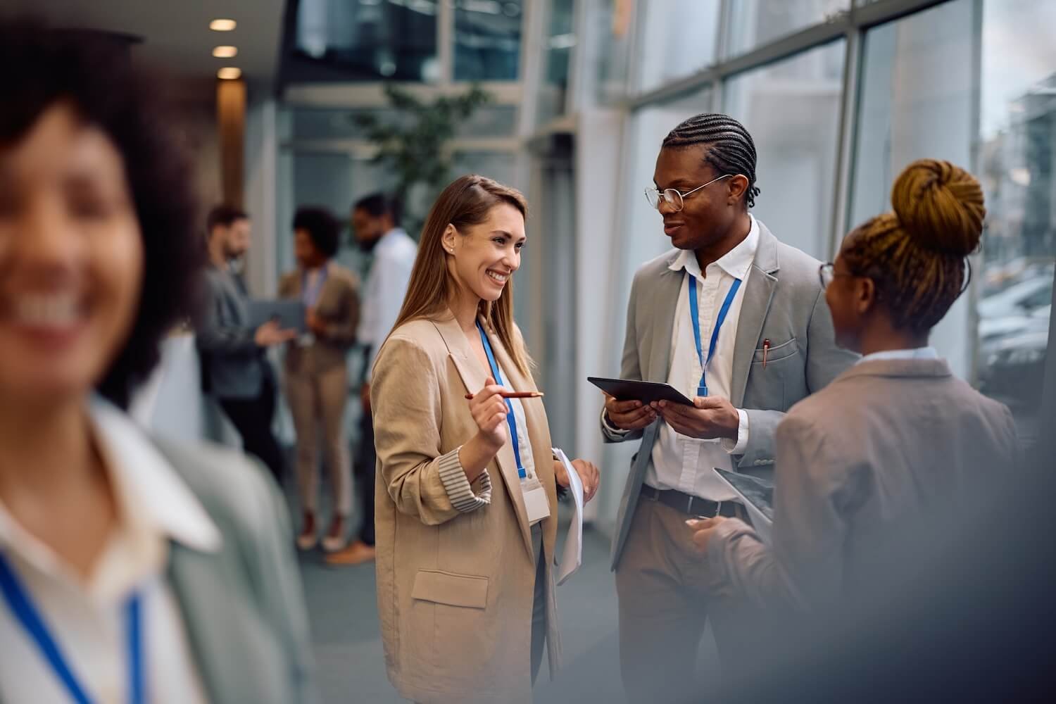Woman in blazer networks at a business event.