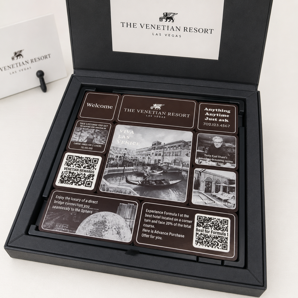 Open Clever Chocolates Venetian Resort presentation box featuring edible Las Vegas designs, QR codes and resort guest information.