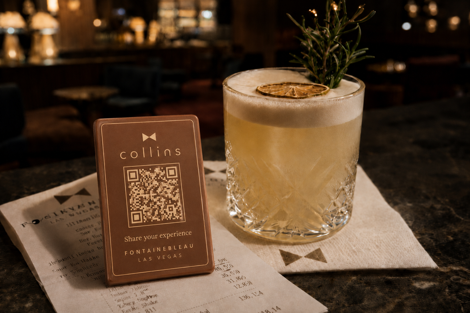 Cocktail beside a QR-enabled Clever Chocolate for restaurant guest feedback.
