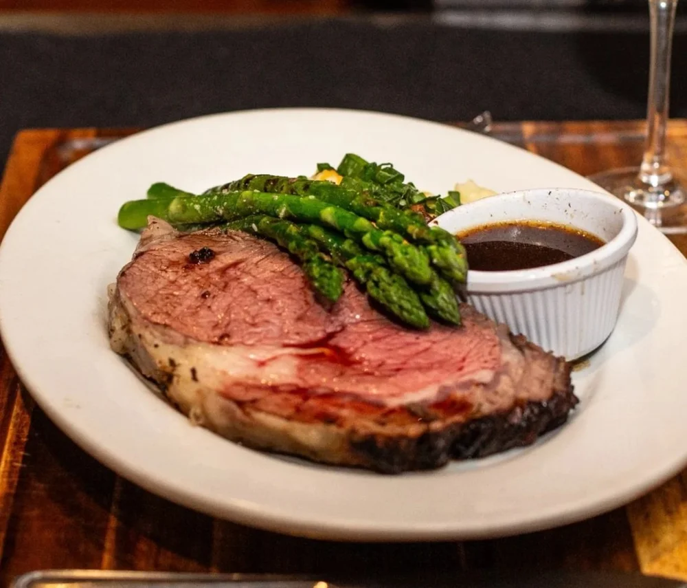 Prime rib with grilled asparagus and au jus at Windward Tavern in Alpharetta, Georgia