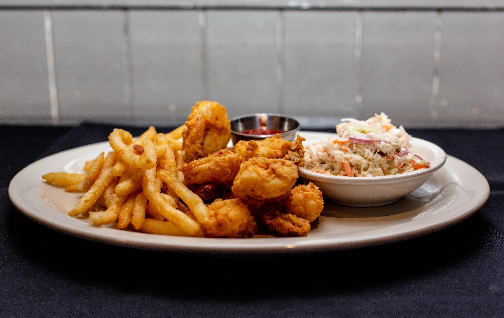 Fried Shrimp at Windward Tavern in Alpharetta, Georgia, with french fries, coleslaw and cocktail sauce