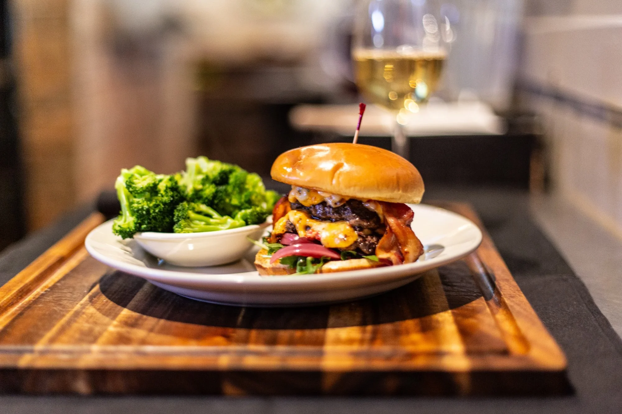 Butcher Burger with two smashed patties, pimento cheese, bacon and pickled onions at Windward Tavern in Alpharetta, Georgia