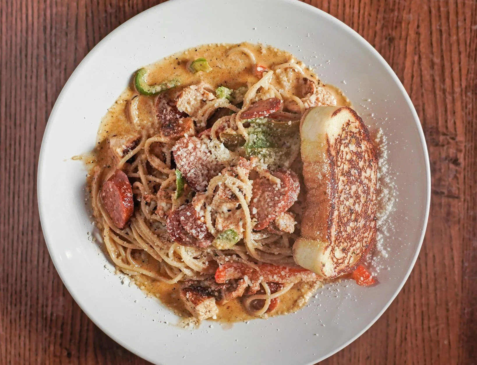 Blackened chicken and andouille sausage over linguini in a cajun alfredo sauce, with garlic bread. Served after 4:00 at Windward Tavern in Alpharetta, GA.