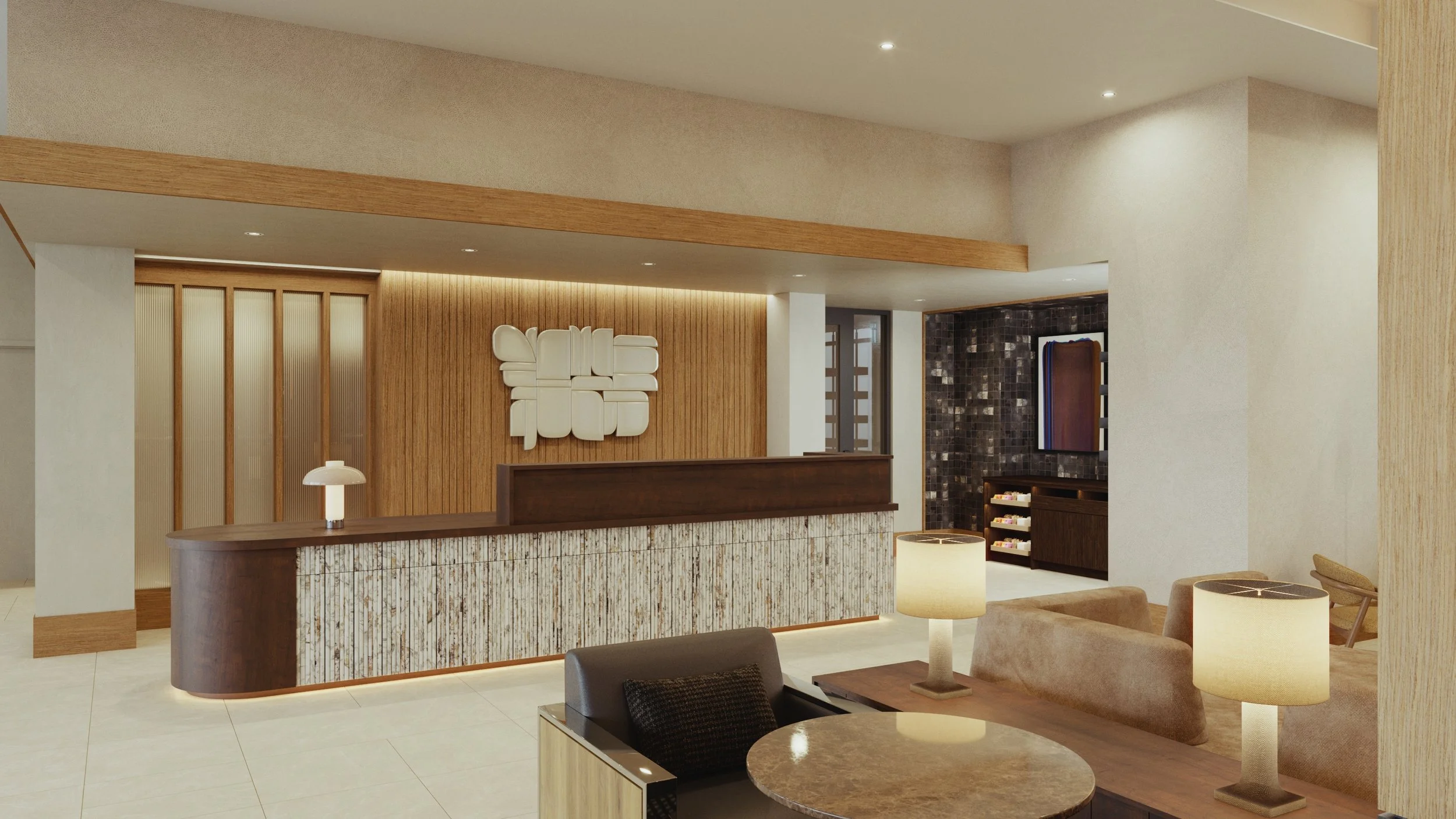 Interior of a hotel lobby with a reception desk, modern furniture, and decorative wall art.
