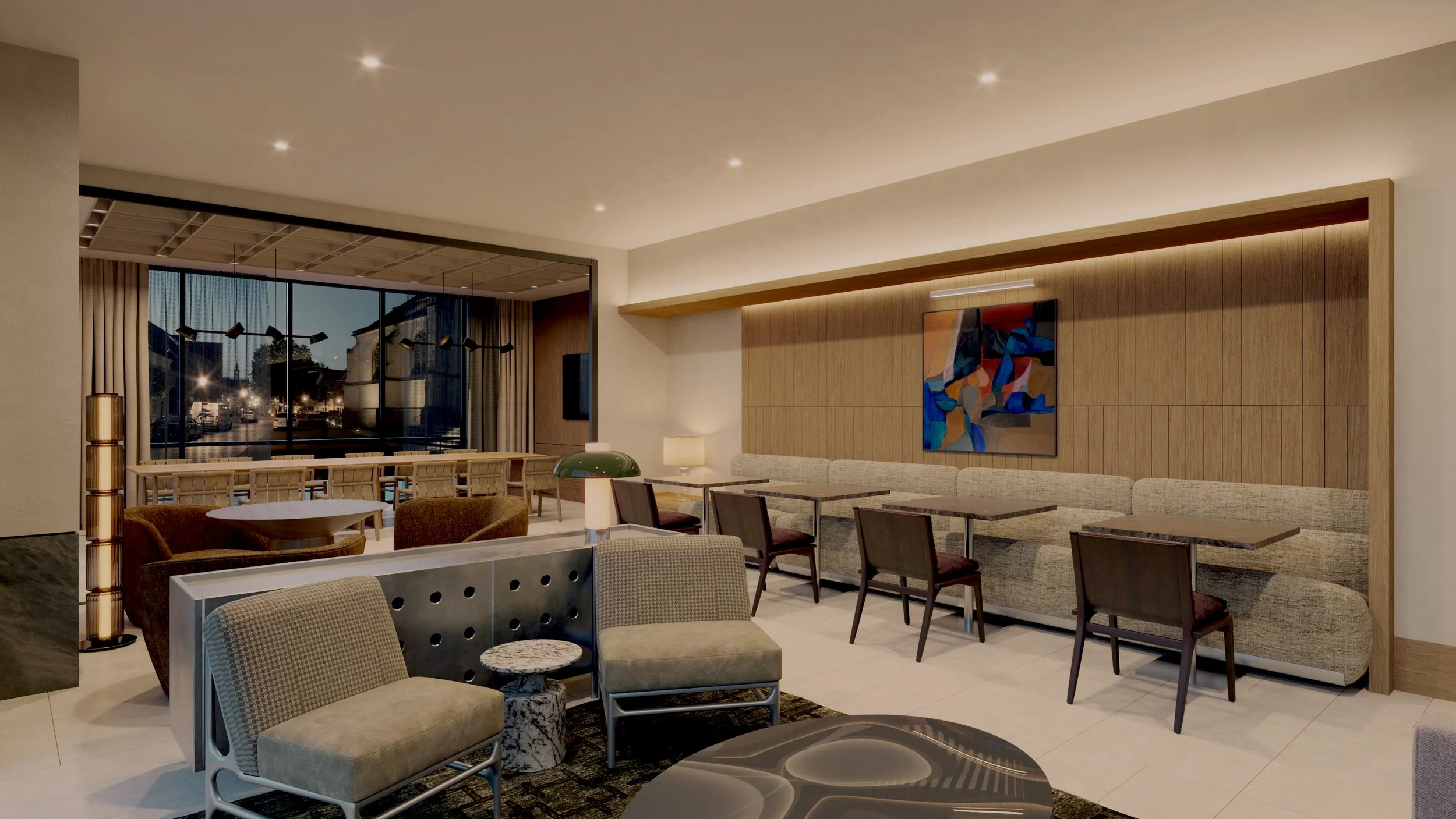 Modern hotel lobby with seating area, wooden wall paneling, colorful abstract art, and large window showing the city outside at dusk.