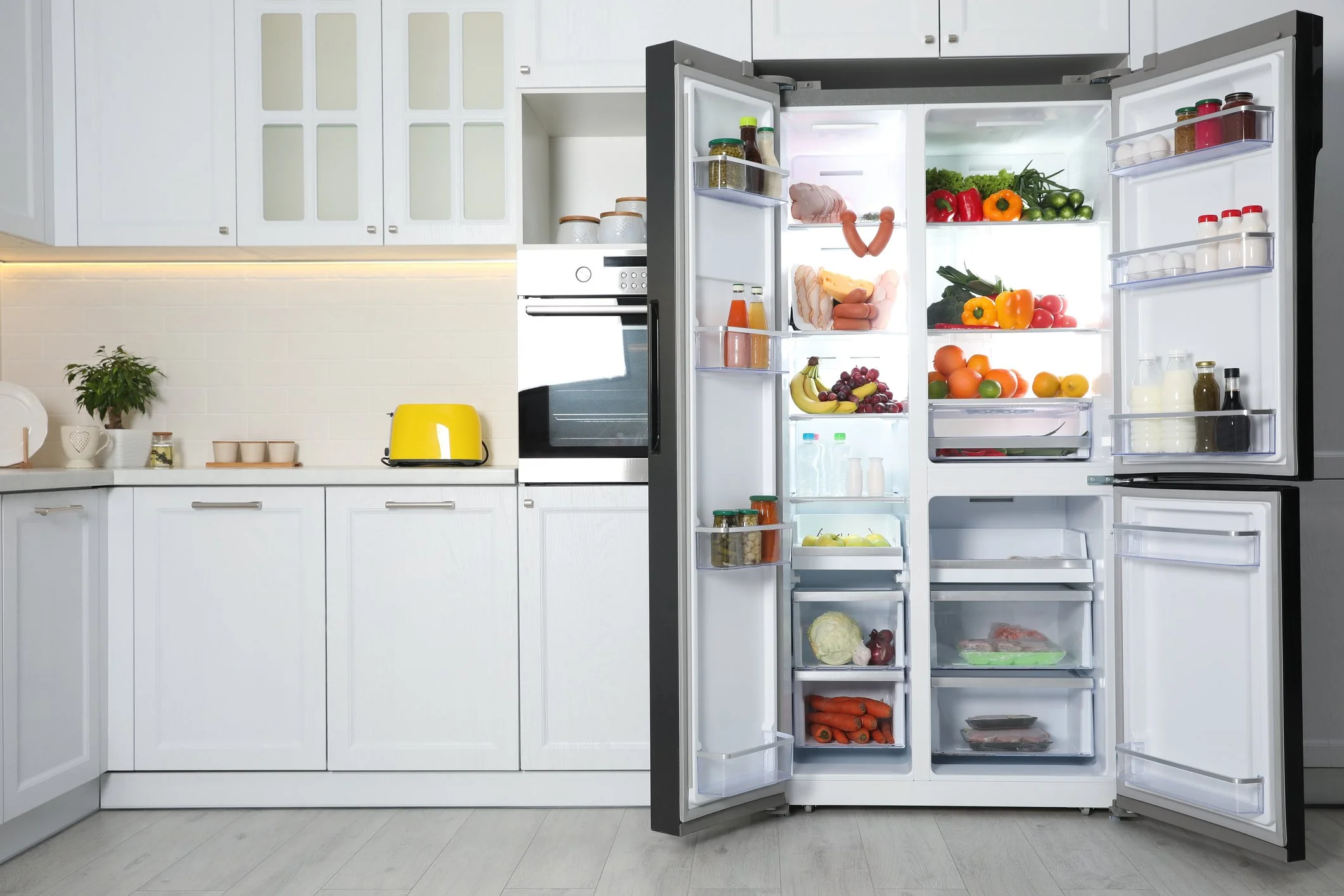 stocked refrigerator with simple foods for beginner meal planning