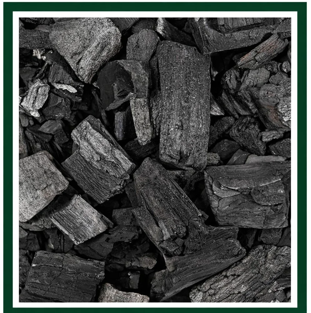 Charcoal pieces of mixed sizes ready for bagging.