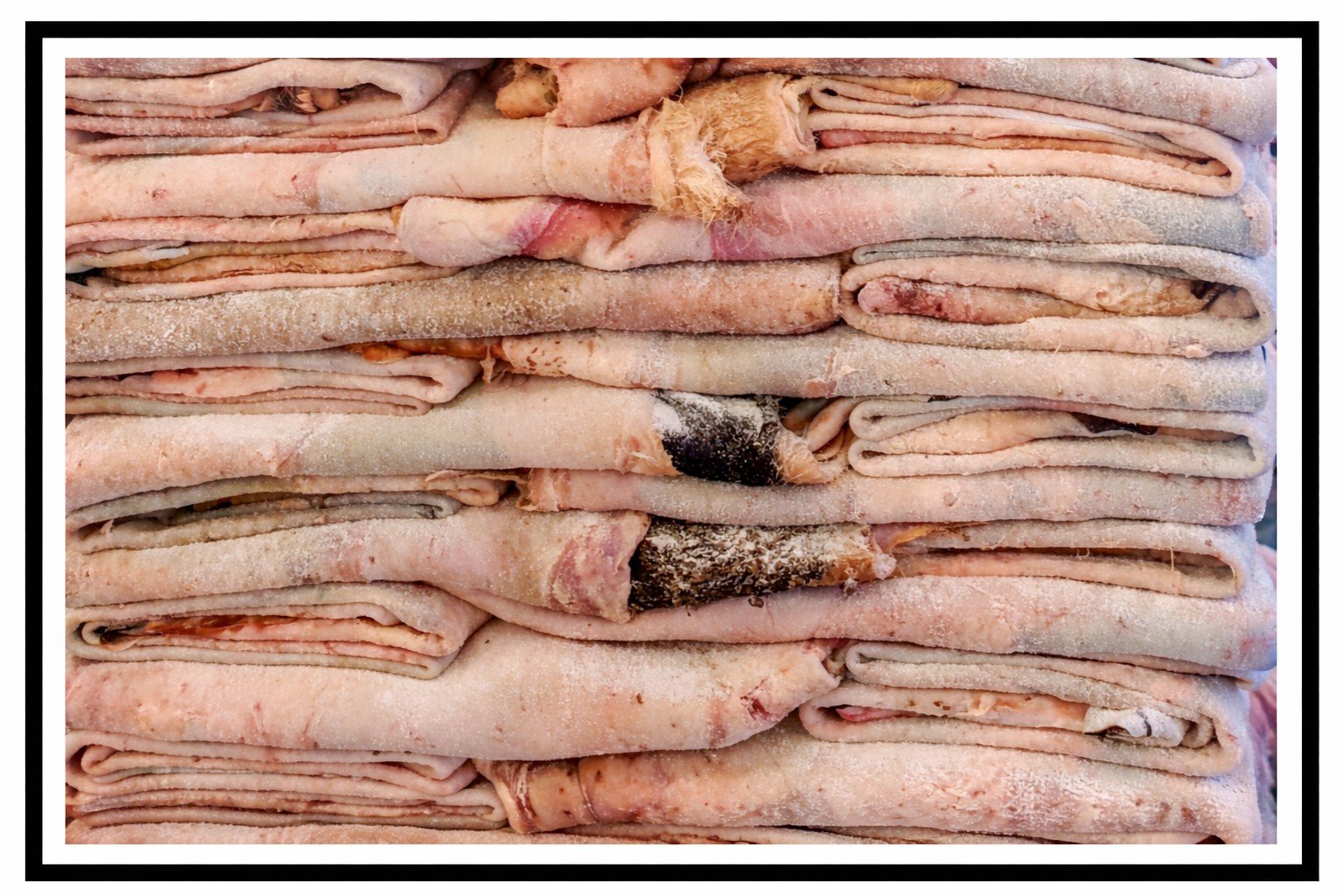 A stack of salted hides ready for shipping.