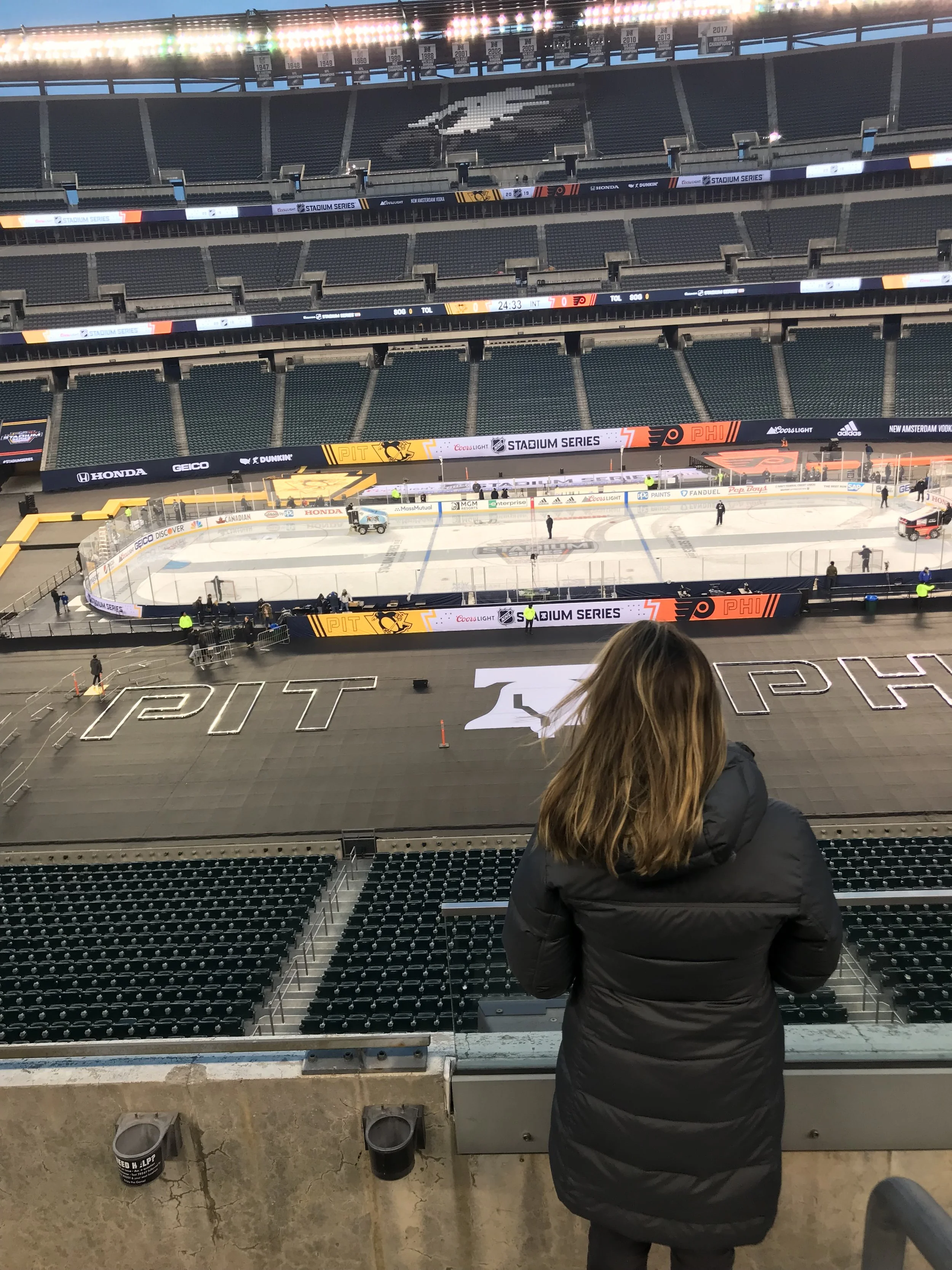 Vanessa Giolitto overseeing on-site content coverage at Philadelphia Flyers NHL Stadium Series event.