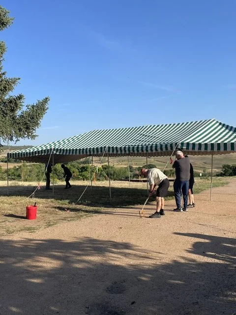 Raising the tent! Parishioners set up the tent for the "mass on the grass" Homecoming celebration August 2026