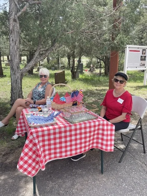 Parishioners offer refreshments for attendees at the Saint Philip's 2026 Memorial Day event