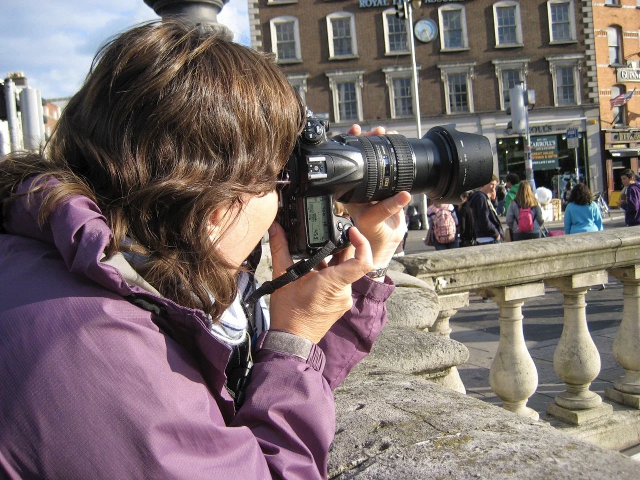 Linda Detwiler Burner photographing a city scene during international travel