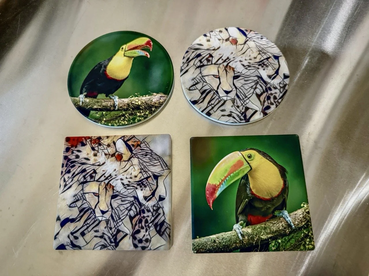 Handcrafted coasters featuring wildlife photography and artistic animal designs by Linda Detwiler Burner