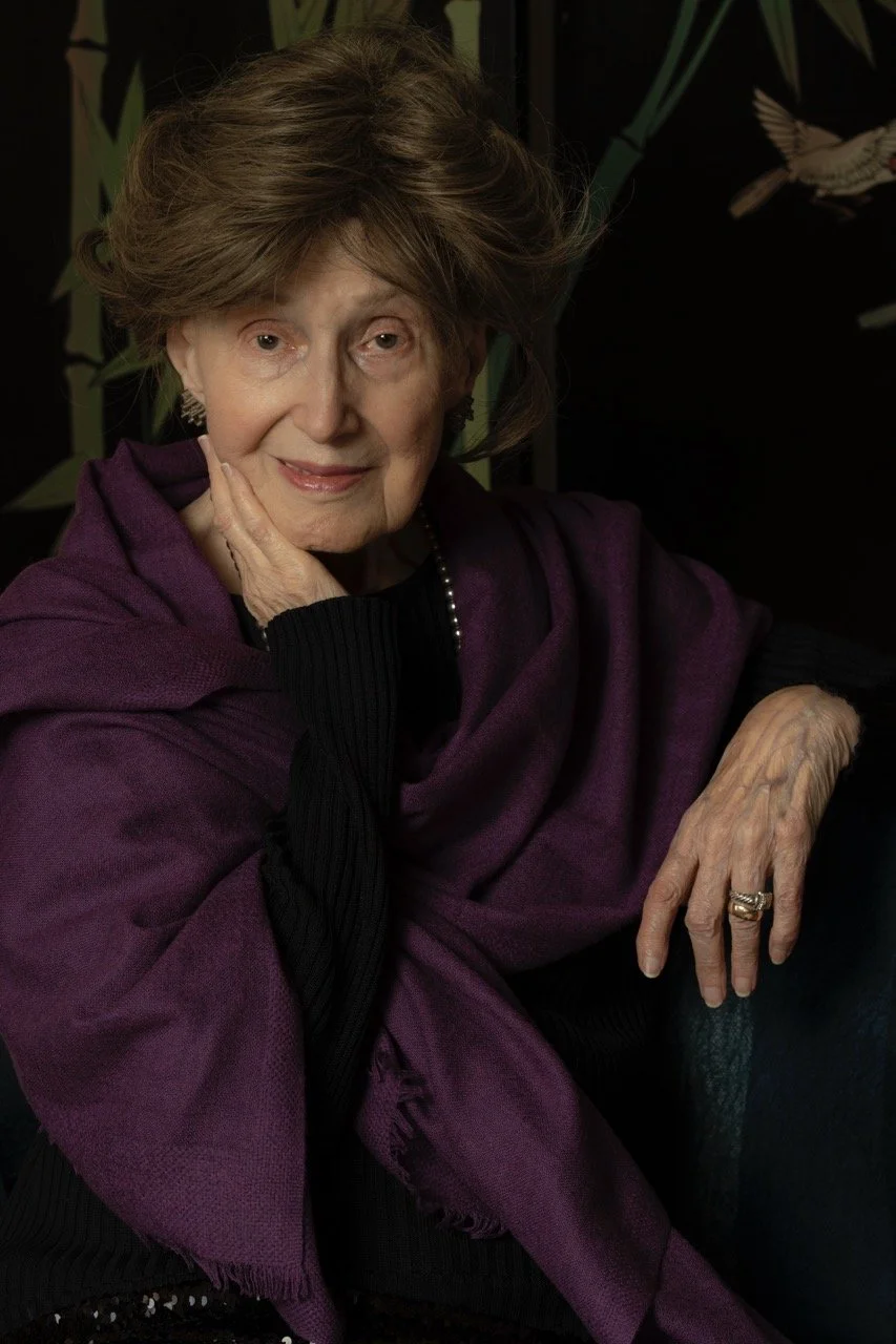 Portrait example by Linda Detwiler Burner featuring an older woman in dramatic studio lighting