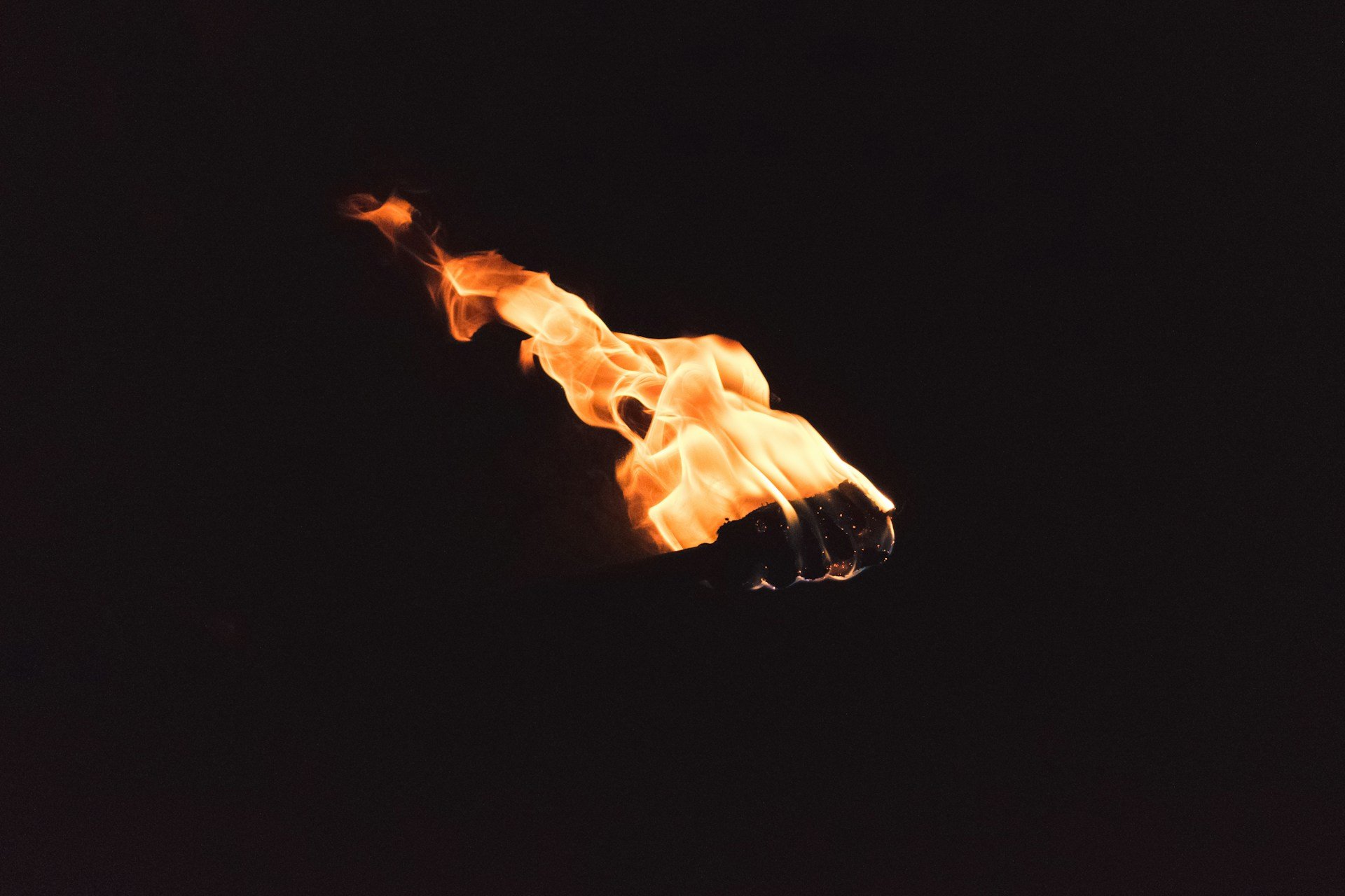 Torch flame against black background — tarot readings in Denver Colorado by Torch & Tower
