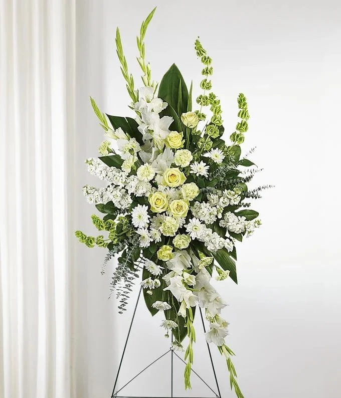 Designer's choice standing funeral spray on an easel offered by Garden of Eden Floral Designs Clearwater FL