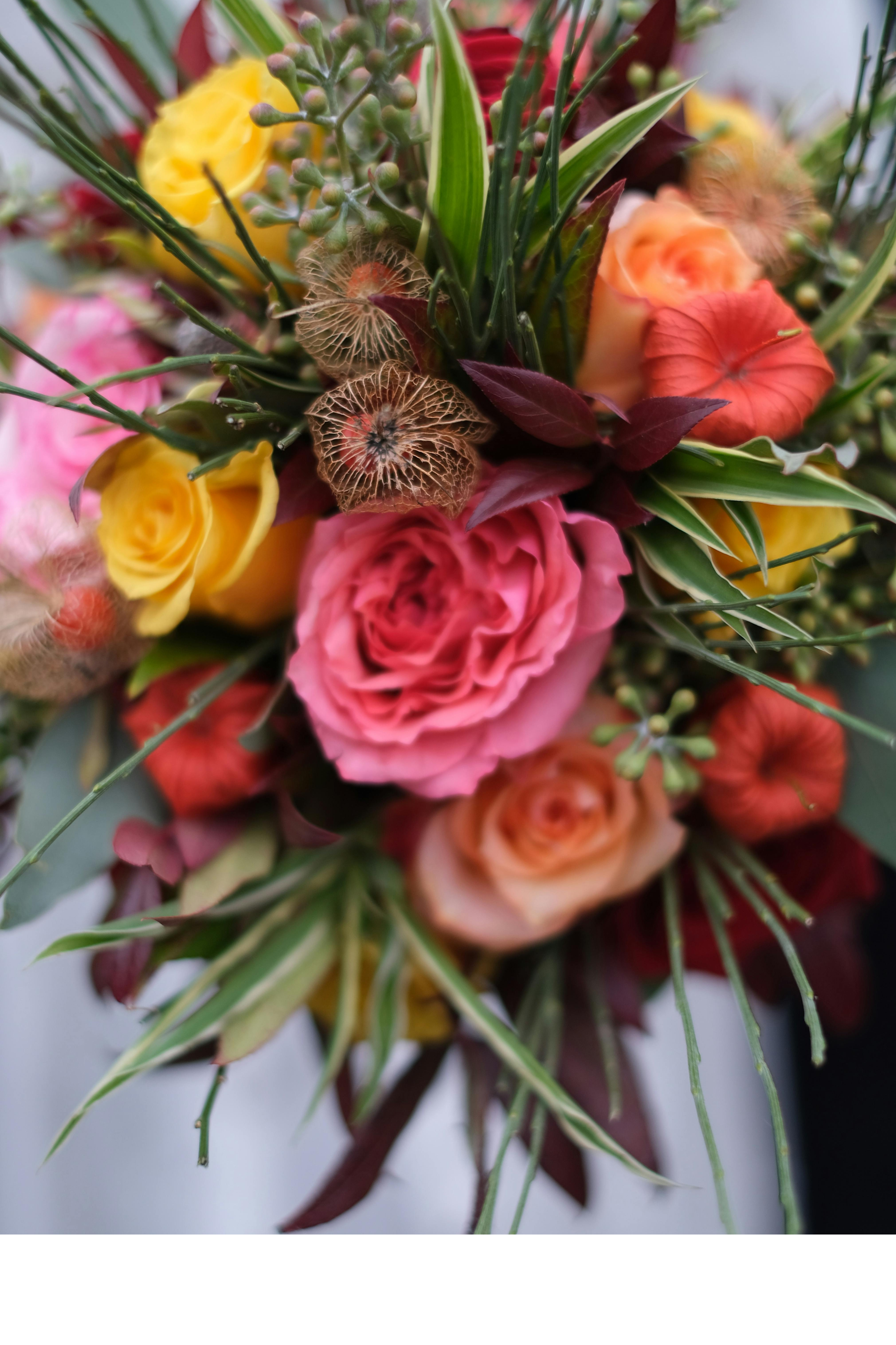 Vibrant Tropical Style

Bring the warmth of the islands to your wedding day. This palette features a high-energy mix of bright oranges, hot pinks, and sunny yellows. Designs are built with vibrant focal blooms and lush tropical greenery (like palm or