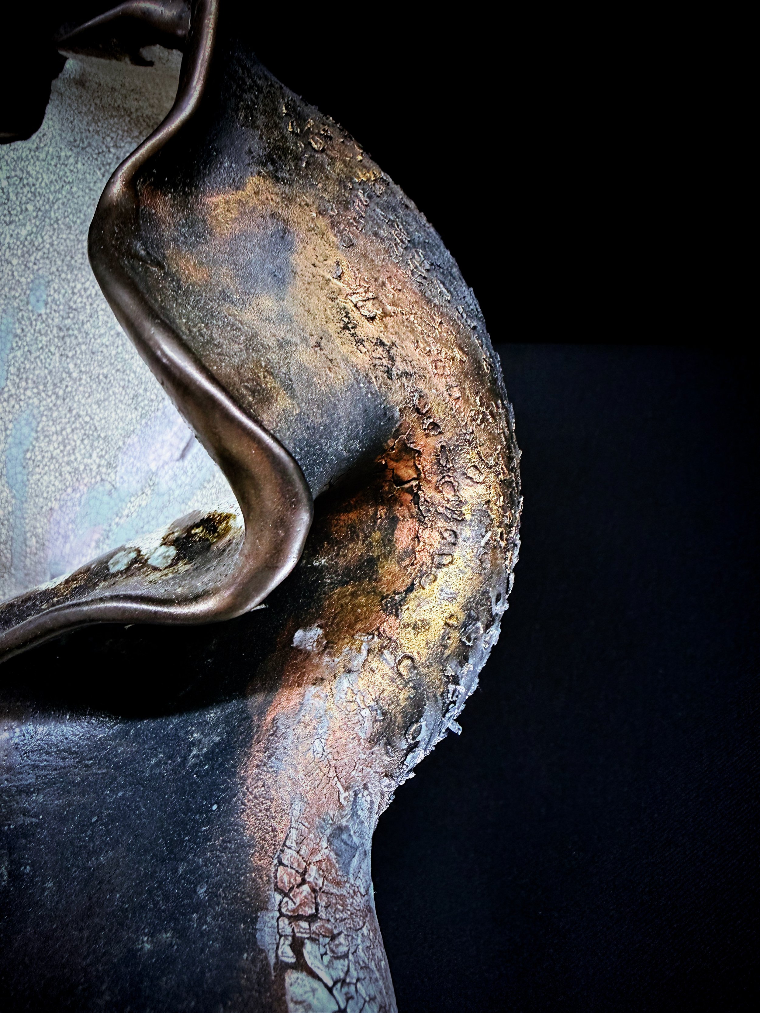 Gold finding edges; some surfaces steady, some resisting, some quietly flaking away.