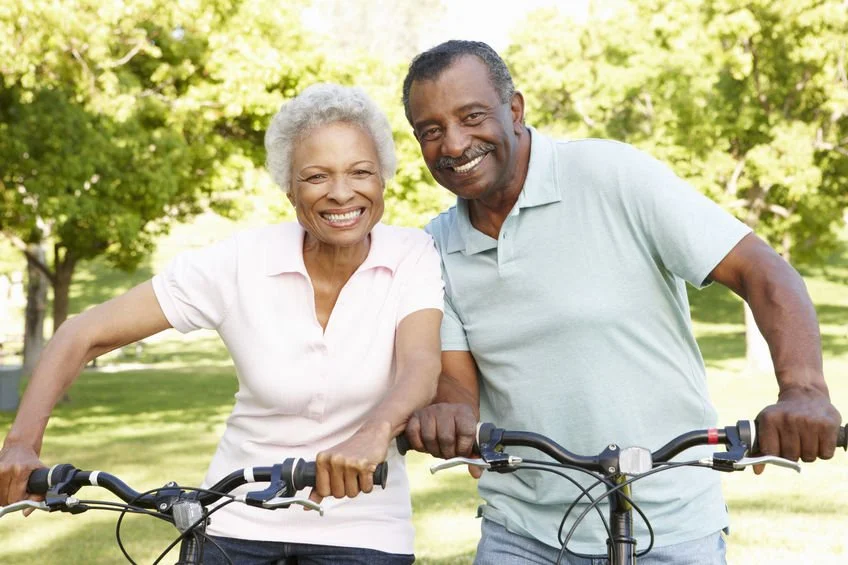 african heritage smiling bikers