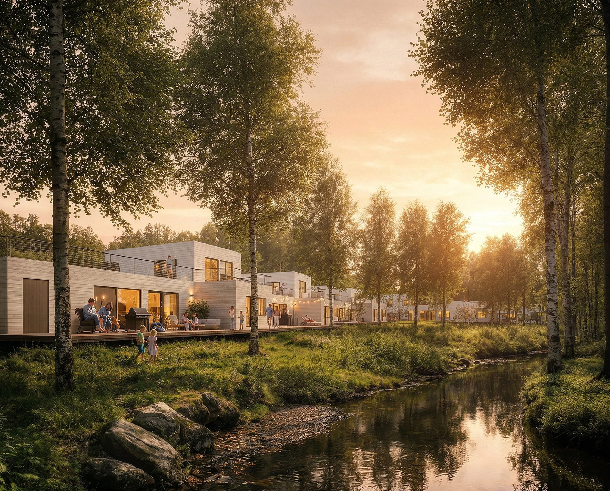 Modern vita hus vid en flod omgiven av gröna träd vid solnedgången.