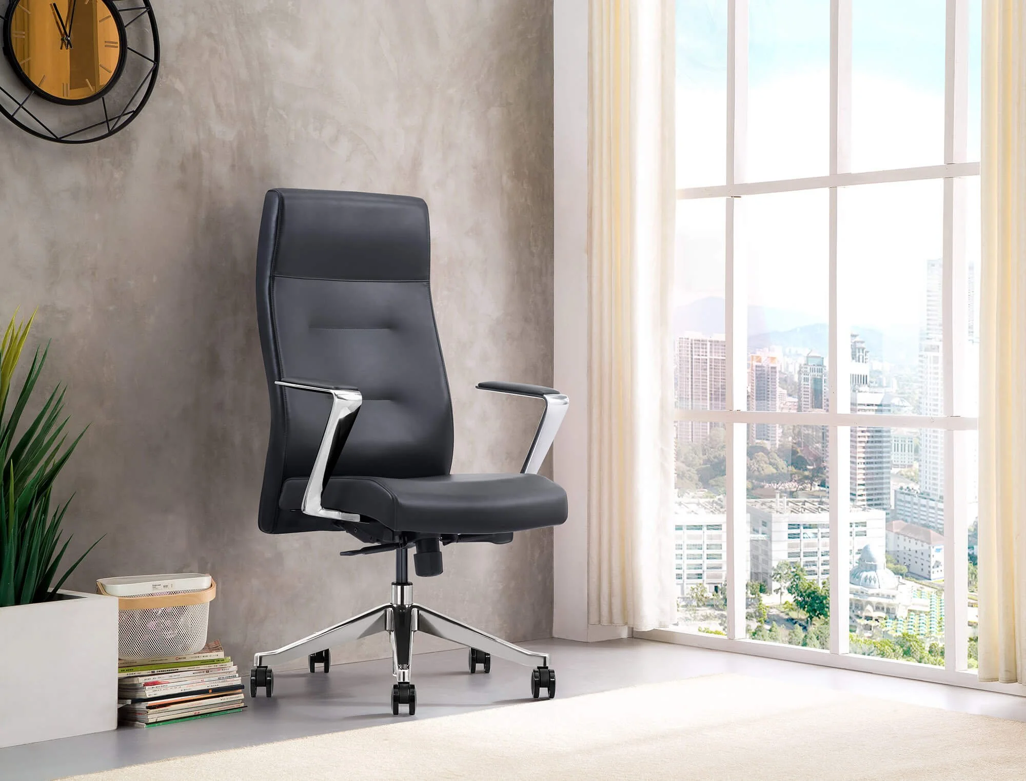 A modern office room with a black ergonomic office chair, a small white side table with a speaker and a stack of magazines, a large window with beige curtains, and a cityscape view.