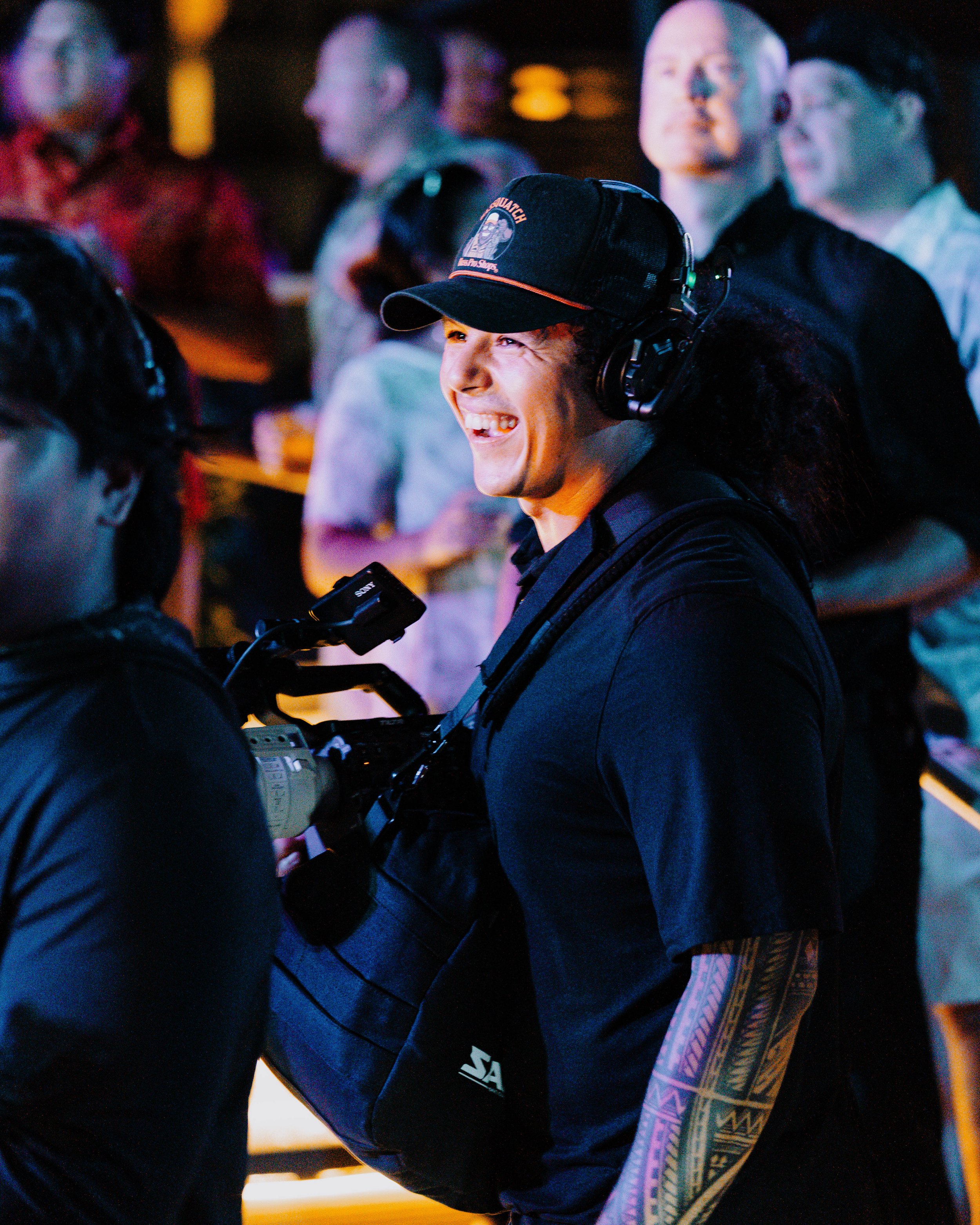 Close-up of a professional camera mounted on a cinema rig, with a matte box and various controls, indicating a film or video production setup.
