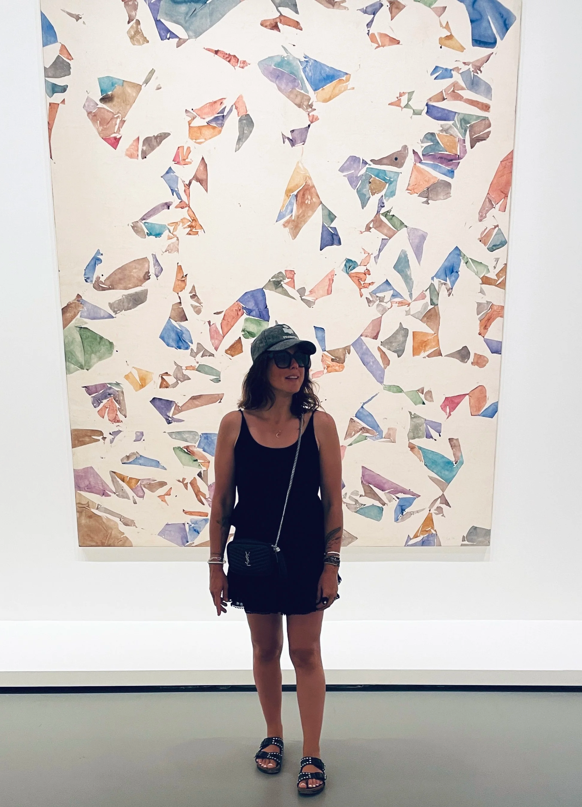 Clementine founder of MUSE Creative Studio standing in front of large abstract painting,  art and intuition editorial
