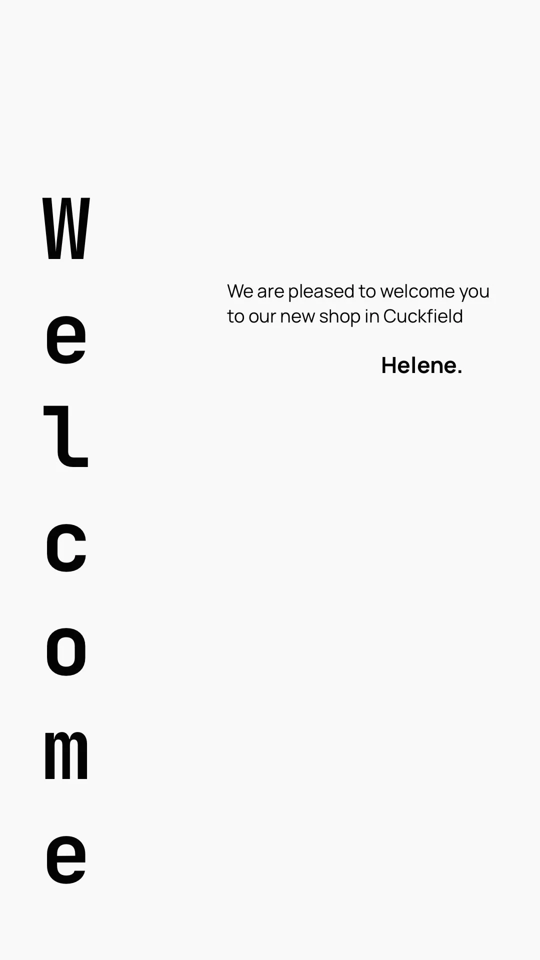 A vertical graphic with the word "Welcome" written in large black letters down the left side. To the right, a message reads: "We are pleased to welcome you to our new shop in Cuckfield. Helene."