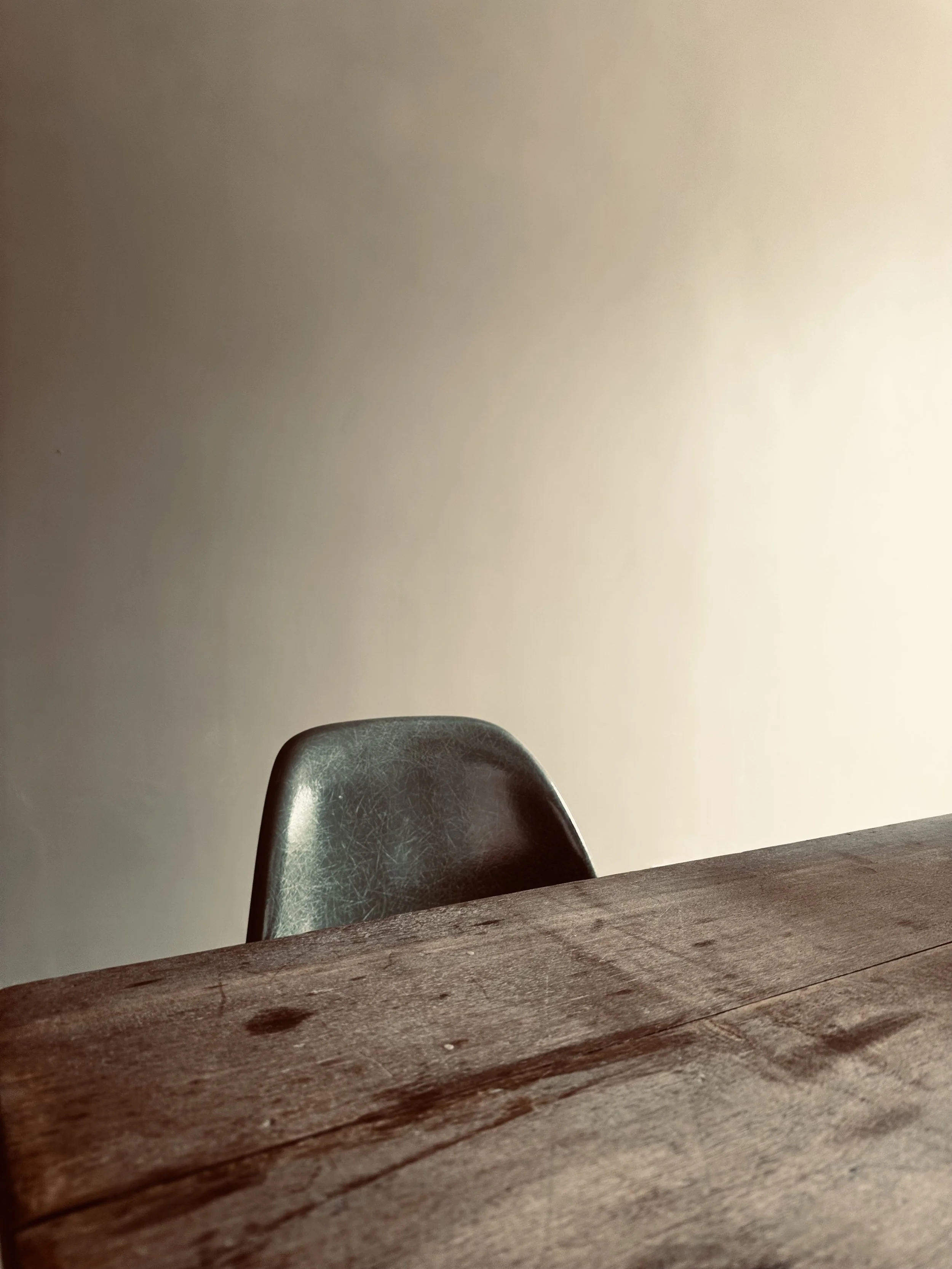 wooden table with black chair