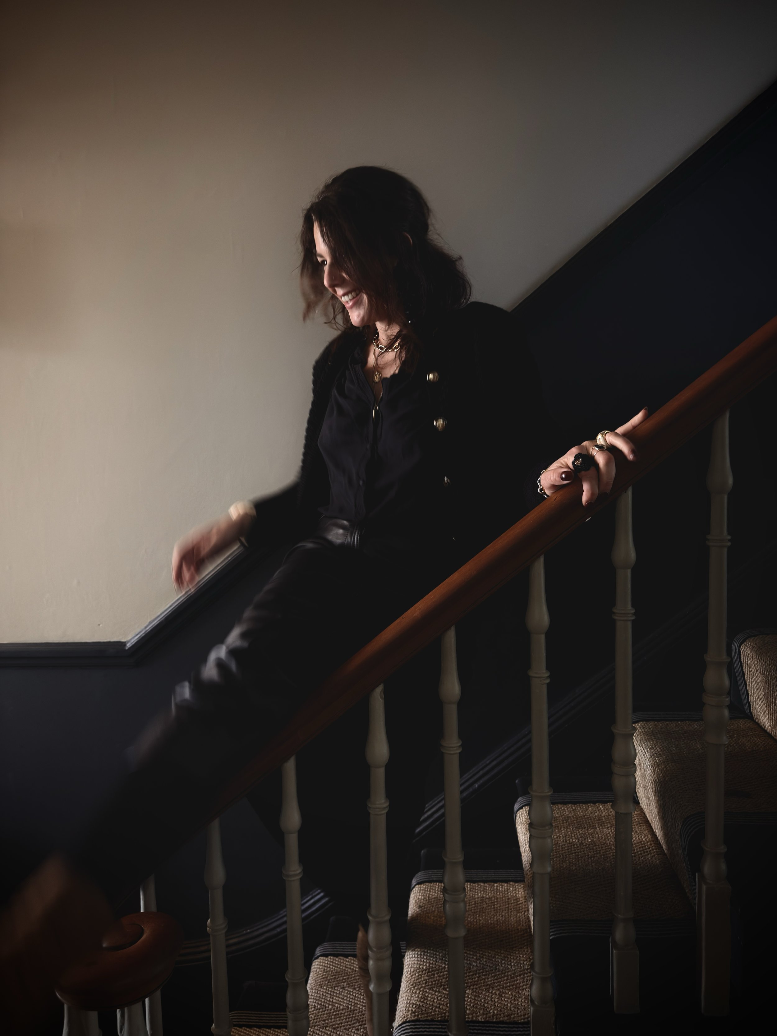 women smiling, going down the stairs