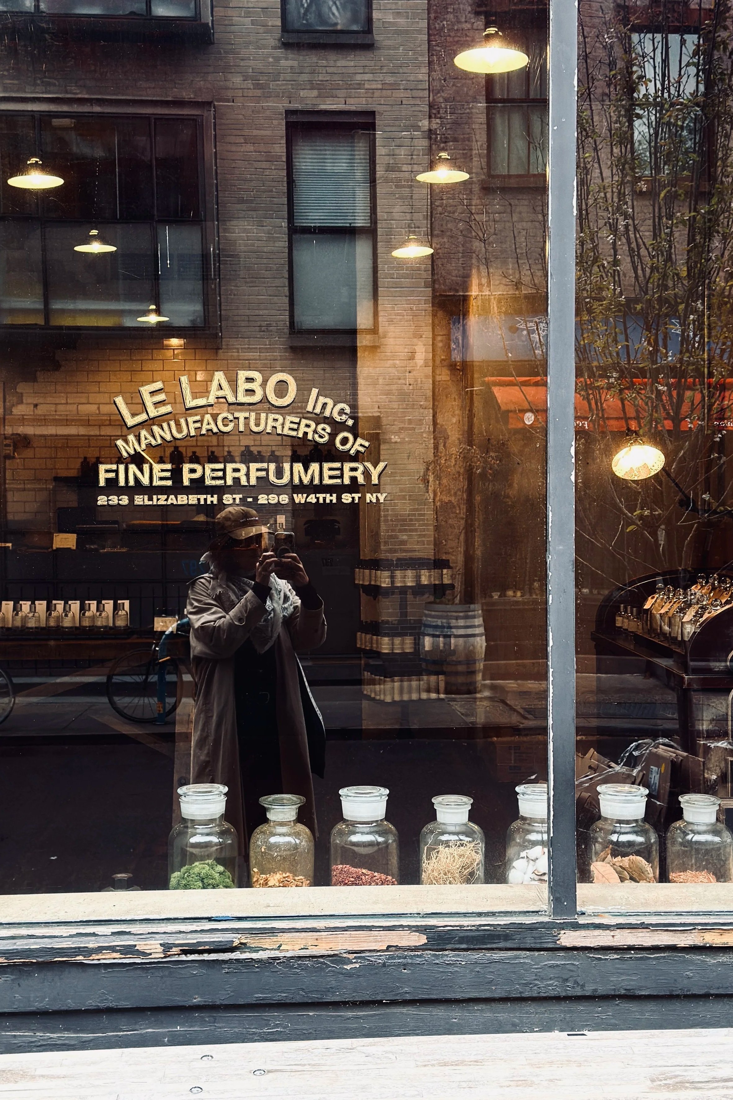 Le Labo perfumery window with gold lettering and glass jars, Elizabeth Street, Nolita