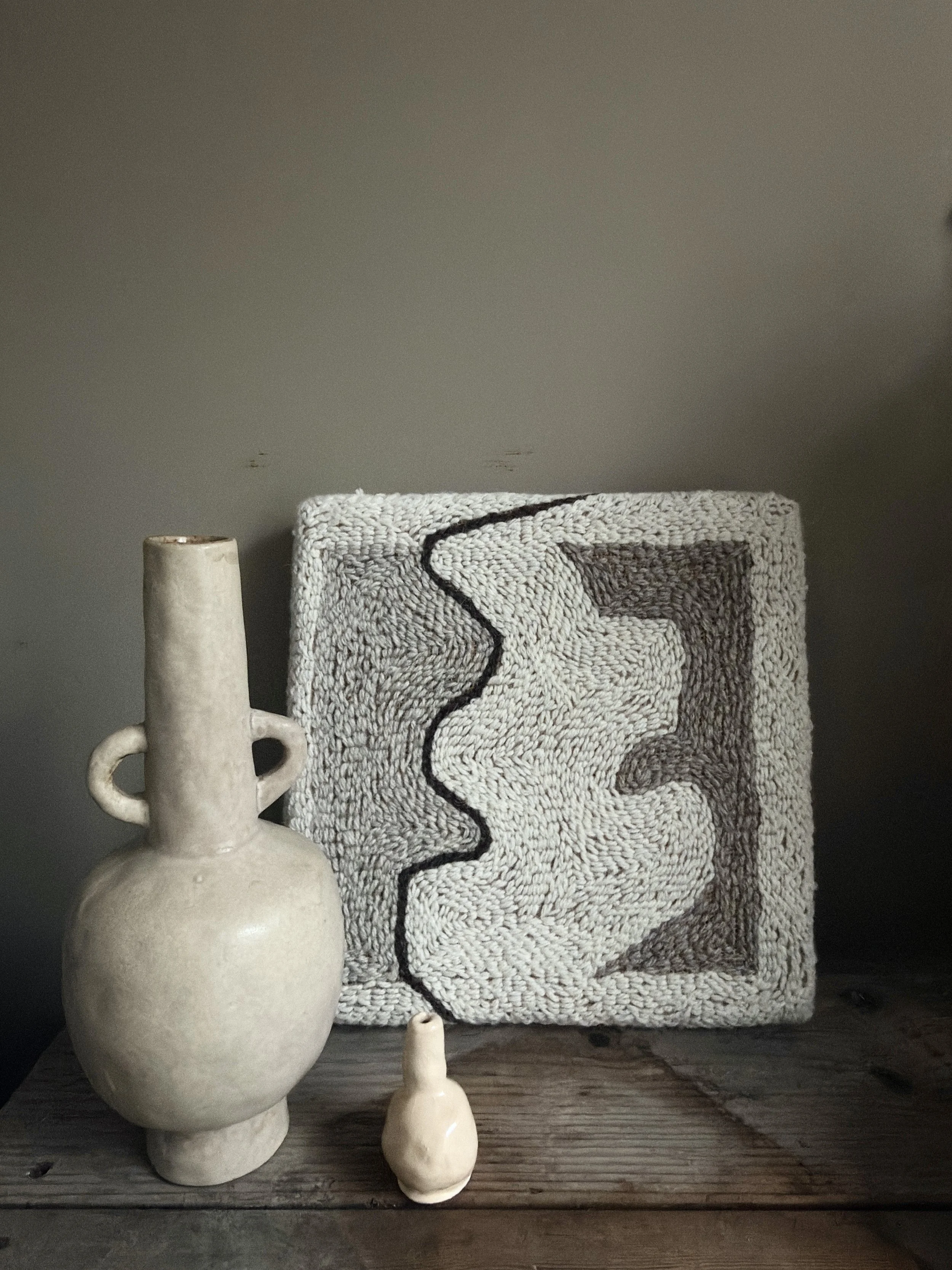 Small Studio Study 001 by Alice Liptrot styled with ceramic vases on a wooden surface, original textile wall art available in The MUSE Shop Brighton