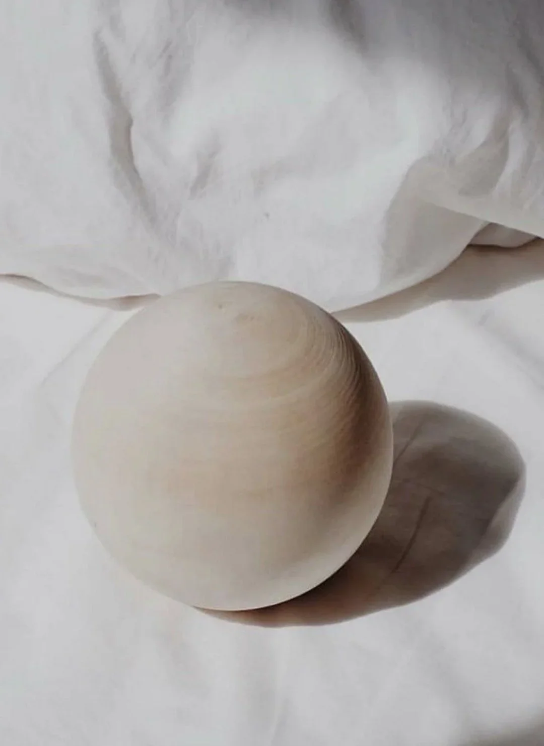 sensory wooden ball on a bed