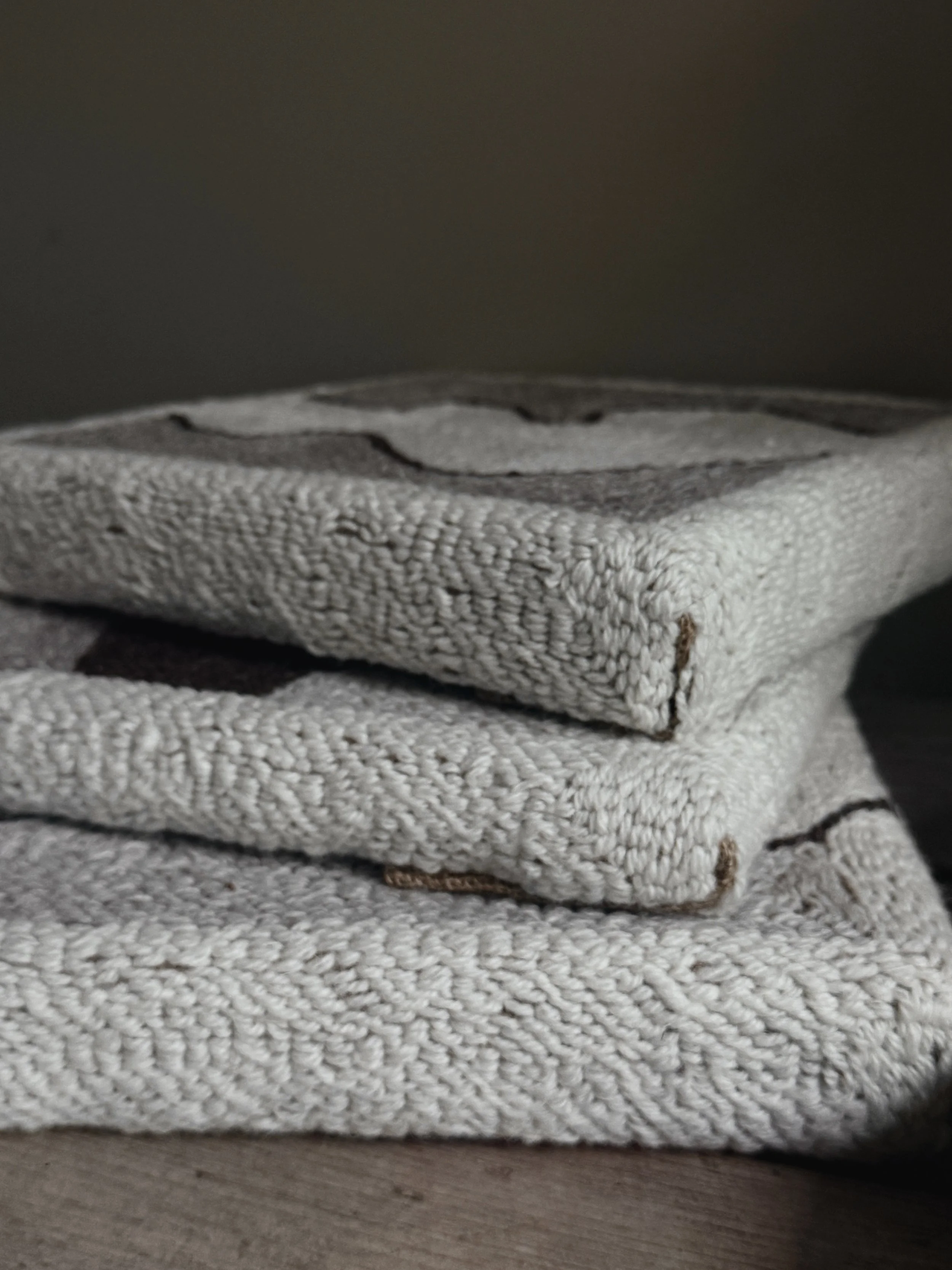 textile wall art series by Alice Liptrot piled on top of each other