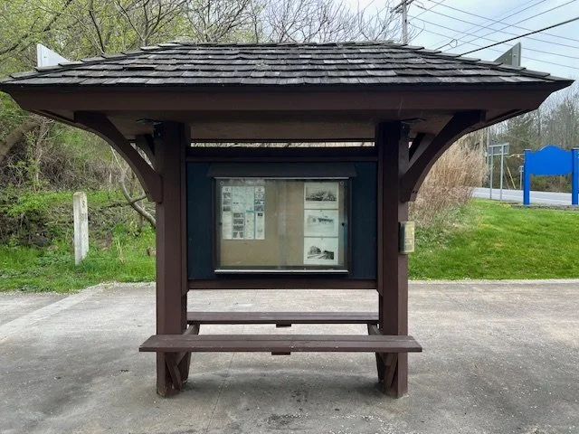 Kiosk and seating on the Auburn Trail next to the Maple Ave road crossing