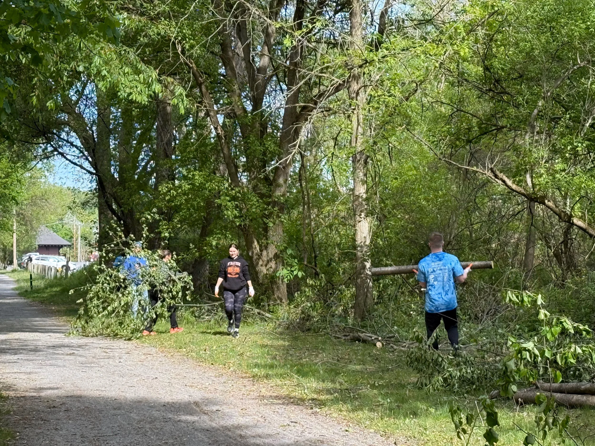 Day of Caring volunteers clearing trail hub area on the Auburn Rail Trail
