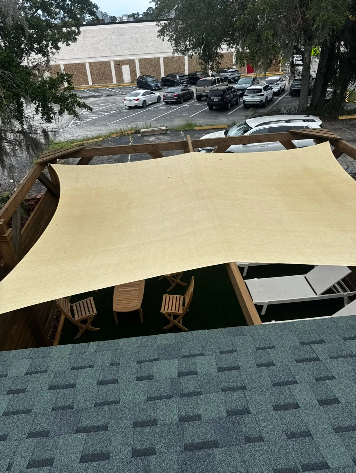 Outdoor rest area under a shade sail at Gainesville Sauna House
