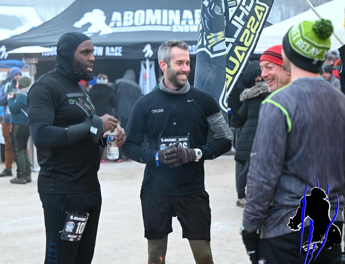 Brett Thomas connecting with athletes before an obstacle course race, highlighting the importance of community in modern health.
