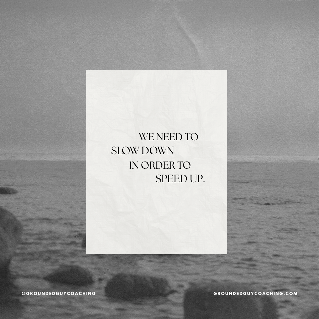 A motivational quote on a crumpled white paper background reading, 'We need to slow down in order to speed up,' over a grayscale beach scene with rocks and the ocean.