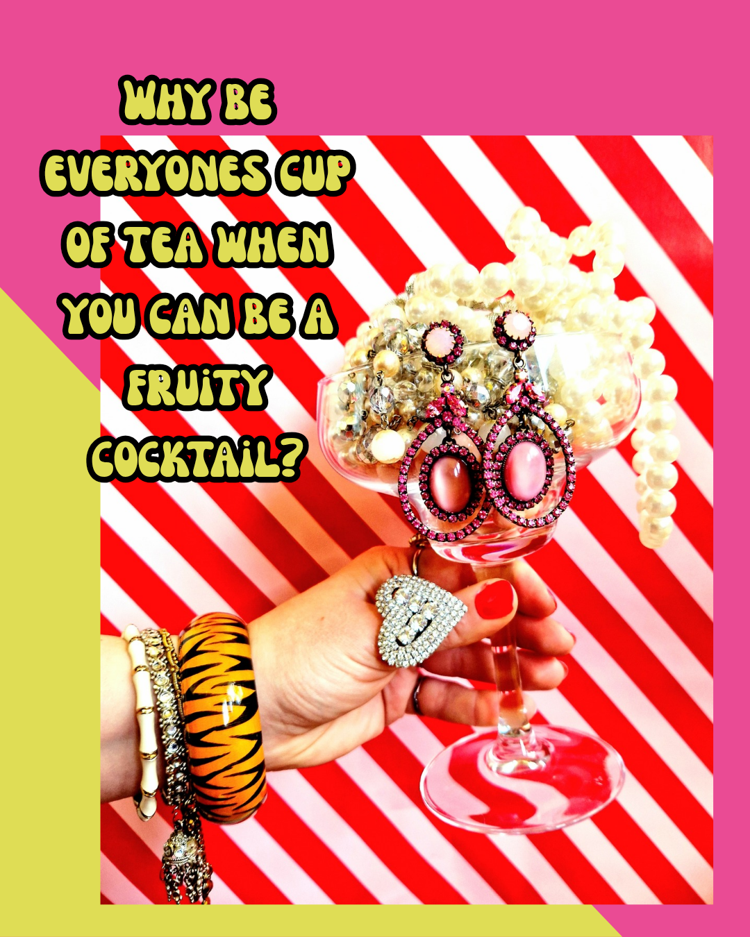 A hand holding a wine glass filled with jewelry, including earrings, necklaces, and bracelets, against a pink and red striped background with playful text about fruity cocktails.